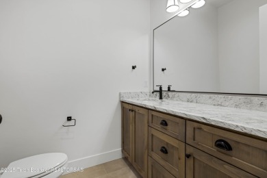 This custom home in Teton Reserve offers a unique plan with on Teton Reserve in Idaho - for sale on GolfHomes.com, golf home, golf lot