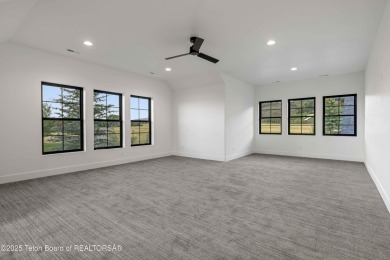 This custom home in Teton Reserve offers a unique plan with on Teton Reserve in Idaho - for sale on GolfHomes.com, golf home, golf lot