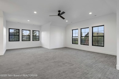 This custom home in Teton Reserve offers a unique plan with on Teton Reserve in Idaho - for sale on GolfHomes.com, golf home, golf lot