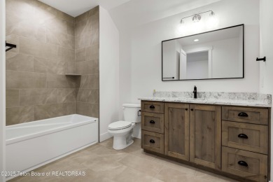 This custom home in Teton Reserve offers a unique plan with on Teton Reserve in Idaho - for sale on GolfHomes.com, golf home, golf lot