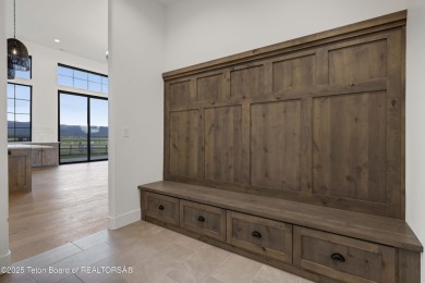 This custom home in Teton Reserve offers a unique plan with on Teton Reserve in Idaho - for sale on GolfHomes.com, golf home, golf lot