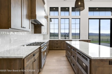 This custom home in Teton Reserve offers a unique plan with on Teton Reserve in Idaho - for sale on GolfHomes.com, golf home, golf lot