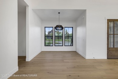 This custom home in Teton Reserve offers a unique plan with on Teton Reserve in Idaho - for sale on GolfHomes.com, golf home, golf lot