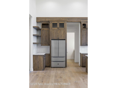 This custom home in Teton Reserve offers a unique plan with on Teton Reserve in Idaho - for sale on GolfHomes.com, golf home, golf lot