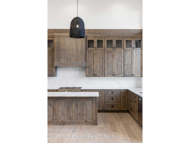 This custom home in Teton Reserve offers a unique plan with on Teton Reserve in Idaho - for sale on GolfHomes.com, golf home, golf lot
