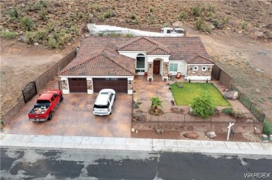 Situated alongside the scenic Cerbat Cliffs Golf Course, this on Cerbat Cliffs Golf Course in Arizona - for sale on GolfHomes.com, golf home, golf lot