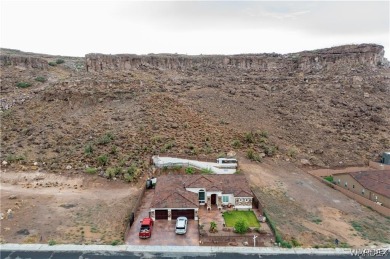 Situated alongside the scenic Cerbat Cliffs Golf Course, this on Cerbat Cliffs Golf Course in Arizona - for sale on GolfHomes.com, golf home, golf lot