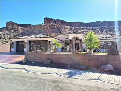 Situated alongside the scenic Cerbat Cliffs Golf Course, this on Cerbat Cliffs Golf Course in Arizona - for sale on GolfHomes.com, golf home, golf lot