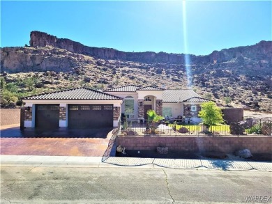 Situated alongside the scenic Cerbat Cliffs Golf Course, this on Cerbat Cliffs Golf Course in Arizona - for sale on GolfHomes.com, golf home, golf lot