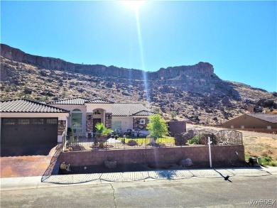 Situated alongside the scenic Cerbat Cliffs Golf Course, this on Cerbat Cliffs Golf Course in Arizona - for sale on GolfHomes.com, golf home, golf lot