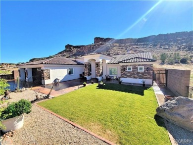 Situated alongside the scenic Cerbat Cliffs Golf Course, this on Cerbat Cliffs Golf Course in Arizona - for sale on GolfHomes.com, golf home, golf lot