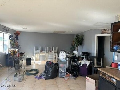 Investor special! Spacious 5-bedroom, 2.5-bath fixer-upper on Oasis Golf Club in Arizona - for sale on GolfHomes.com, golf home, golf lot