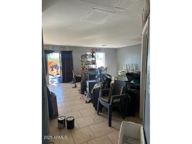 Investor special! Spacious 5-bedroom, 2.5-bath fixer-upper on Oasis Golf Club in Arizona - for sale on GolfHomes.com, golf home, golf lot