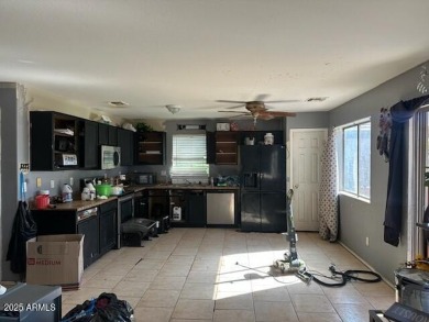 Investor special! Spacious 5-bedroom, 2.5-bath fixer-upper on Oasis Golf Club in Arizona - for sale on GolfHomes.com, golf home, golf lot