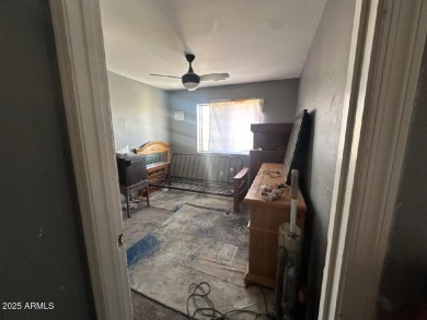 Investor special! Spacious 5-bedroom, 2.5-bath fixer-upper on Oasis Golf Club in Arizona - for sale on GolfHomes.com, golf home, golf lot