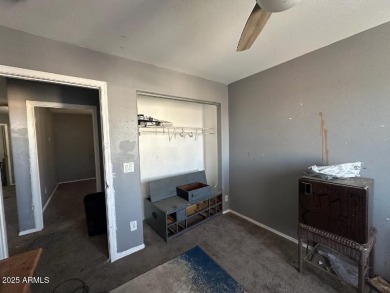Investor special! Spacious 5-bedroom, 2.5-bath fixer-upper on Oasis Golf Club in Arizona - for sale on GolfHomes.com, golf home, golf lot