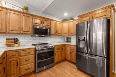 Gorgeous Lake Front Home w/ Private Dock! This 4-bedroom home on Bella Vista Country Club - Berksdale in Arkansas - for sale on GolfHomes.com, golf home, golf lot