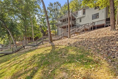 Lake Front Home w/ Private Dock! This 4-bedroom home features a on Bella Vista Country Club - Berksdale in Arkansas - for sale on GolfHomes.com, golf home, golf lot