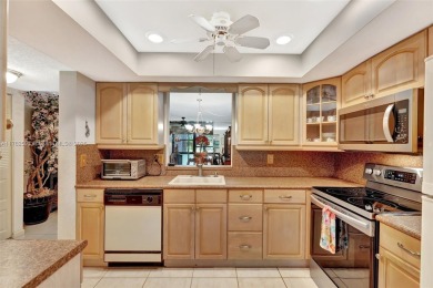 Tucked away in a desirable 55+ community in Margate, this on Oriole Golf and Tennis Club in Florida - for sale on GolfHomes.com, golf home, golf lot