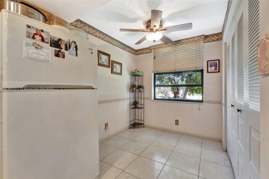 Tucked away in a desirable 55+ community in Margate, this on Oriole Golf and Tennis Club in Florida - for sale on GolfHomes.com, golf home, golf lot