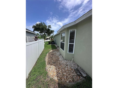 Coastal charm meets convenience in this beautifully kept on University Park Country Club in Florida - for sale on GolfHomes.com, golf home, golf lot