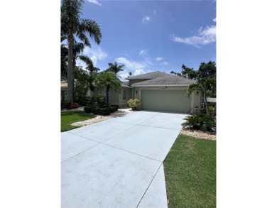 Coastal charm meets convenience in this beautifully kept on University Park Country Club in Florida - for sale on GolfHomes.com, golf home, golf lot
