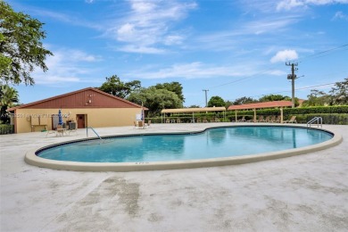 Tucked away in a desirable 55+ community in Margate, this on Oriole Golf and Tennis Club in Florida - for sale on GolfHomes.com, golf home, golf lot