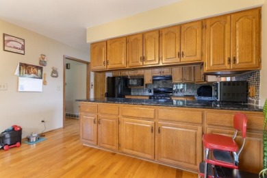 This is a home that checks all the boxes. Inside is a large well on Merrill Golf Club in Wisconsin - for sale on GolfHomes.com, golf home, golf lot