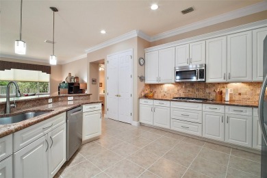 This pristine, expanded Hampton shows pride in ownership at on Eagle Ridge At Spruce Creek Country Club in Florida - for sale on GolfHomes.com, golf home, golf lot