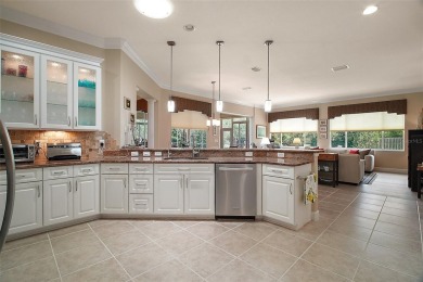 This pristine, expanded Hampton shows pride in ownership at on Eagle Ridge At Spruce Creek Country Club in Florida - for sale on GolfHomes.com, golf home, golf lot