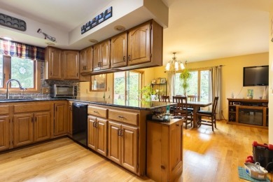 This is a home that checks all the boxes. Inside is a large well on Merrill Golf Club in Wisconsin - for sale on GolfHomes.com, golf home, golf lot
