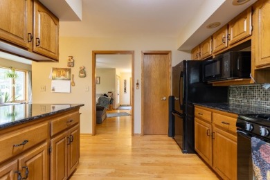 This is a home that checks all the boxes. Inside is a large well on Merrill Golf Club in Wisconsin - for sale on GolfHomes.com, golf home, golf lot