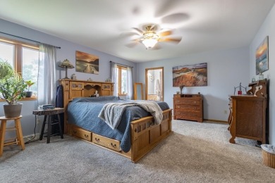 This is a home that checks all the boxes. Inside is a large well on Merrill Golf Club in Wisconsin - for sale on GolfHomes.com, golf home, golf lot