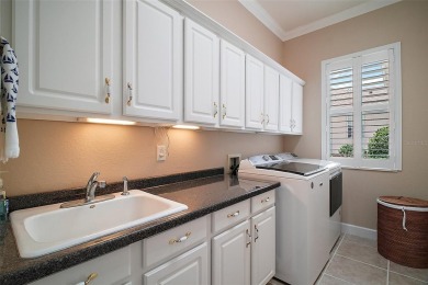 This pristine, expanded Hampton shows pride in ownership at on Eagle Ridge At Spruce Creek Country Club in Florida - for sale on GolfHomes.com, golf home, golf lot