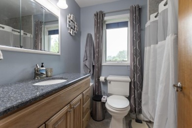 This is a home that checks all the boxes. Inside is a large well on Merrill Golf Club in Wisconsin - for sale on GolfHomes.com, golf home, golf lot