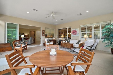 This pristine, expanded Hampton shows pride in ownership at on Eagle Ridge At Spruce Creek Country Club in Florida - for sale on GolfHomes.com, golf home, golf lot