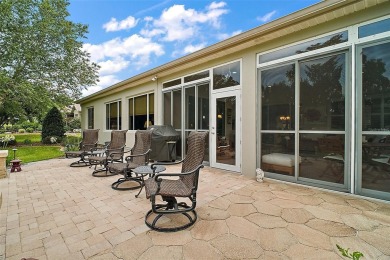This pristine, expanded Hampton shows pride in ownership at on Eagle Ridge At Spruce Creek Country Club in Florida - for sale on GolfHomes.com, golf home, golf lot