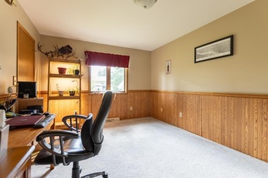 This is a home that checks all the boxes. Inside is a large well on Merrill Golf Club in Wisconsin - for sale on GolfHomes.com, golf home, golf lot