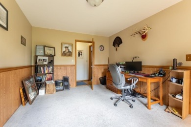 This is a home that checks all the boxes. Inside is a large well on Merrill Golf Club in Wisconsin - for sale on GolfHomes.com, golf home, golf lot