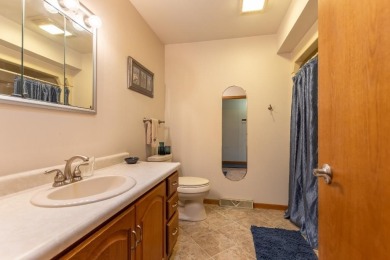 This is a home that checks all the boxes. Inside is a large well on Merrill Golf Club in Wisconsin - for sale on GolfHomes.com, golf home, golf lot