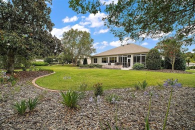 This pristine, expanded Hampton shows pride in ownership at on Eagle Ridge At Spruce Creek Country Club in Florida - for sale on GolfHomes.com, golf home, golf lot