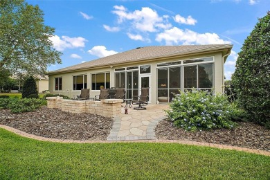 This pristine, expanded Hampton shows pride in ownership at on Eagle Ridge At Spruce Creek Country Club in Florida - for sale on GolfHomes.com, golf home, golf lot