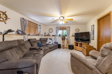 This is a home that checks all the boxes. Inside is a large well on Merrill Golf Club in Wisconsin - for sale on GolfHomes.com, golf home, golf lot