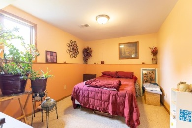 This is a home that checks all the boxes. Inside is a large well on Merrill Golf Club in Wisconsin - for sale on GolfHomes.com, golf home, golf lot