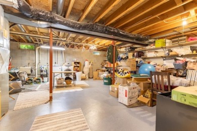 This is a home that checks all the boxes. Inside is a large well on Merrill Golf Club in Wisconsin - for sale on GolfHomes.com, golf home, golf lot