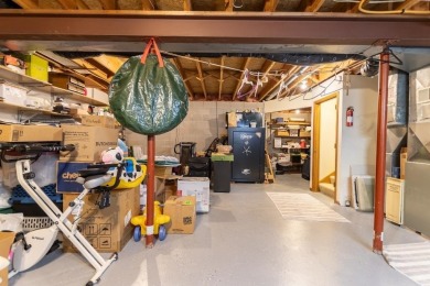This is a home that checks all the boxes. Inside is a large well on Merrill Golf Club in Wisconsin - for sale on GolfHomes.com, golf home, golf lot