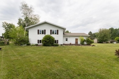 This is a home that checks all the boxes. Inside is a large well on Merrill Golf Club in Wisconsin - for sale on GolfHomes.com, golf home, golf lot