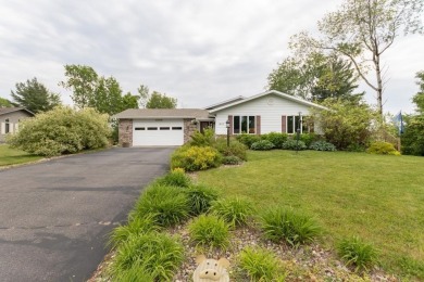 This is a home that checks all the boxes. Inside is a large well on Merrill Golf Club in Wisconsin - for sale on GolfHomes.com, golf home, golf lot