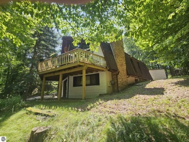 Located in Canadian Lakes Development with access to 11 private on Canadian Lakes Country Club-The Highlands Course in Michigan - for sale on GolfHomes.com, golf home, golf lot