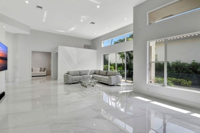 What a spectacular 3 bedroom 4 bath contemporary remodeled home on Broken Sound Golf and Club  in Florida - for sale on GolfHomes.com, golf home, golf lot